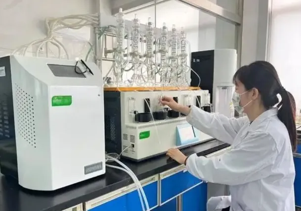Technician conducting a ROSE test to detect ionic contamination on a PCB