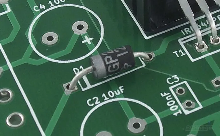 Technician troubleshooting PCB using clear silkscreen markings for component identification