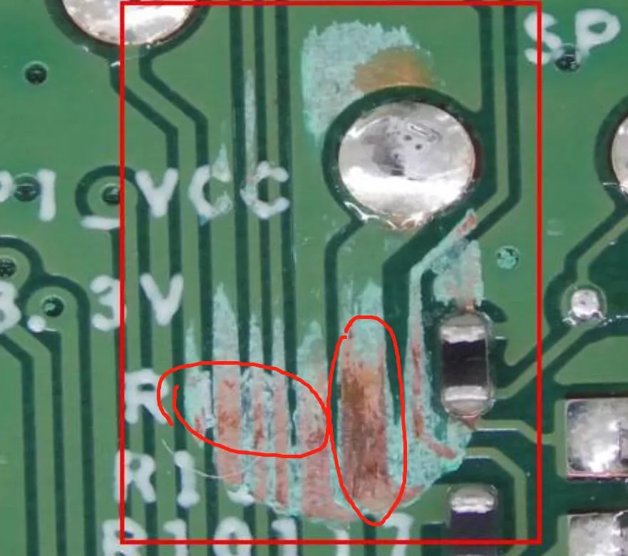 PCB with green solder mask under inspection for defects