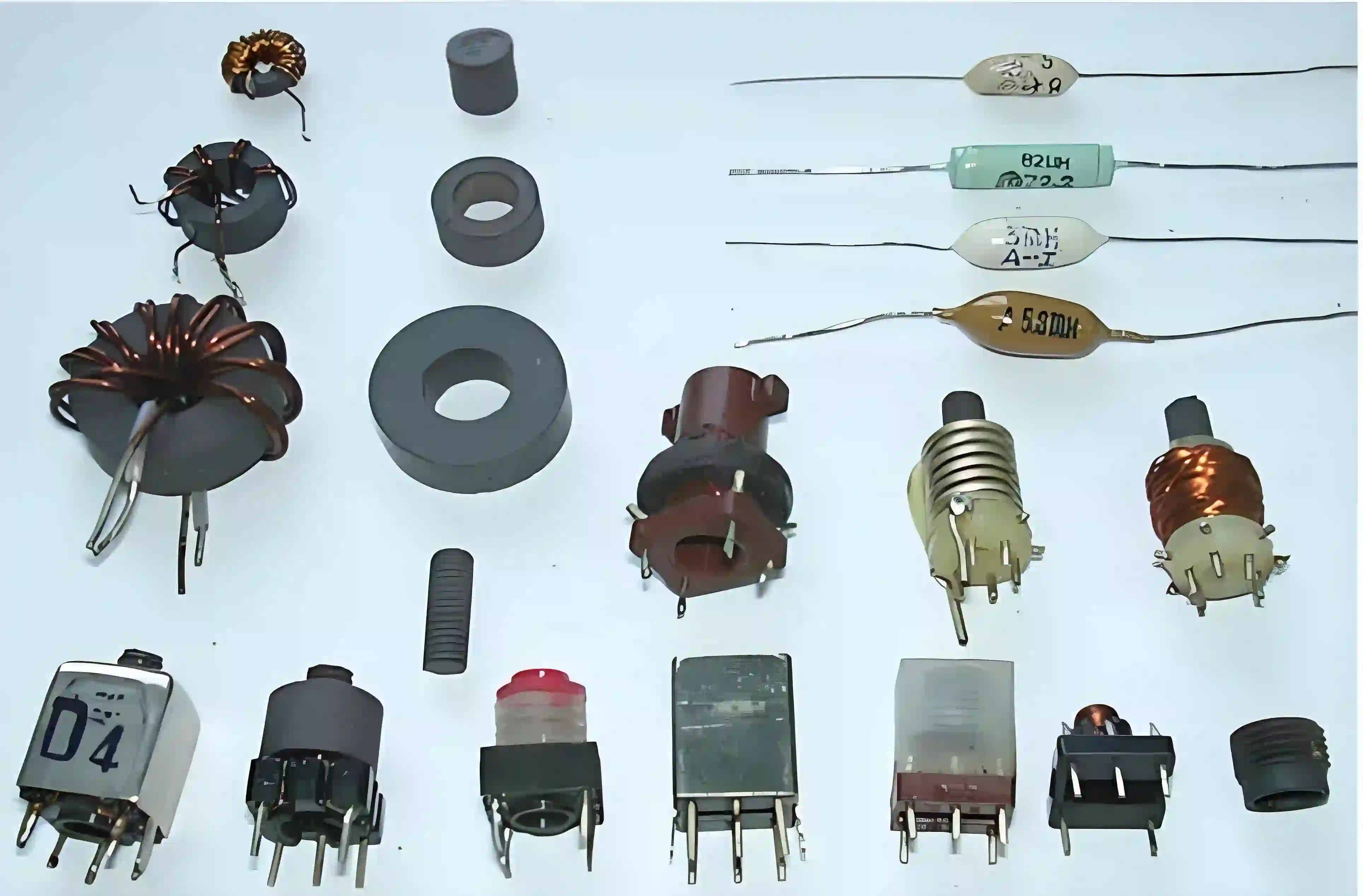 Various through-hole capacitor types for identification.