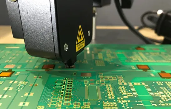 Small PCB undergoing automated optical inspection for quality control.