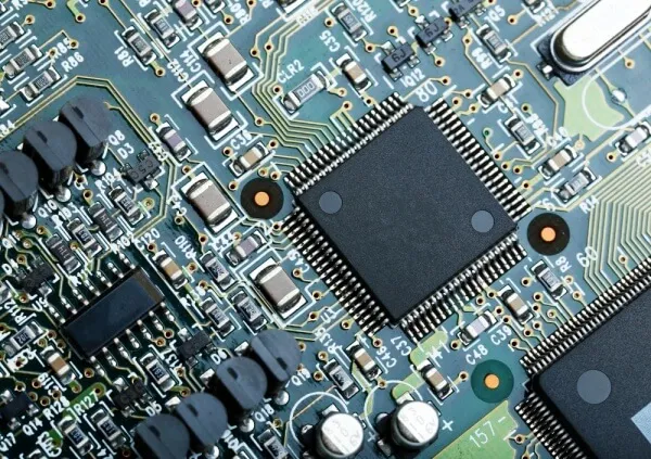Close-up of SMT-assembled PCB with surface-mounted components.