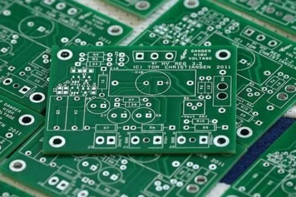 Single-sided PCB with green solder mask for protection.