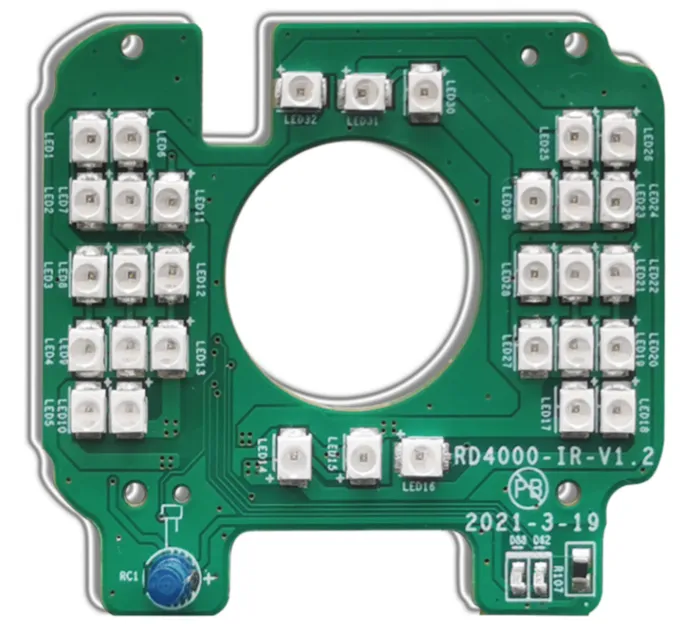 Close-up of PCB silkscreen with polarity markings for accurate component placement