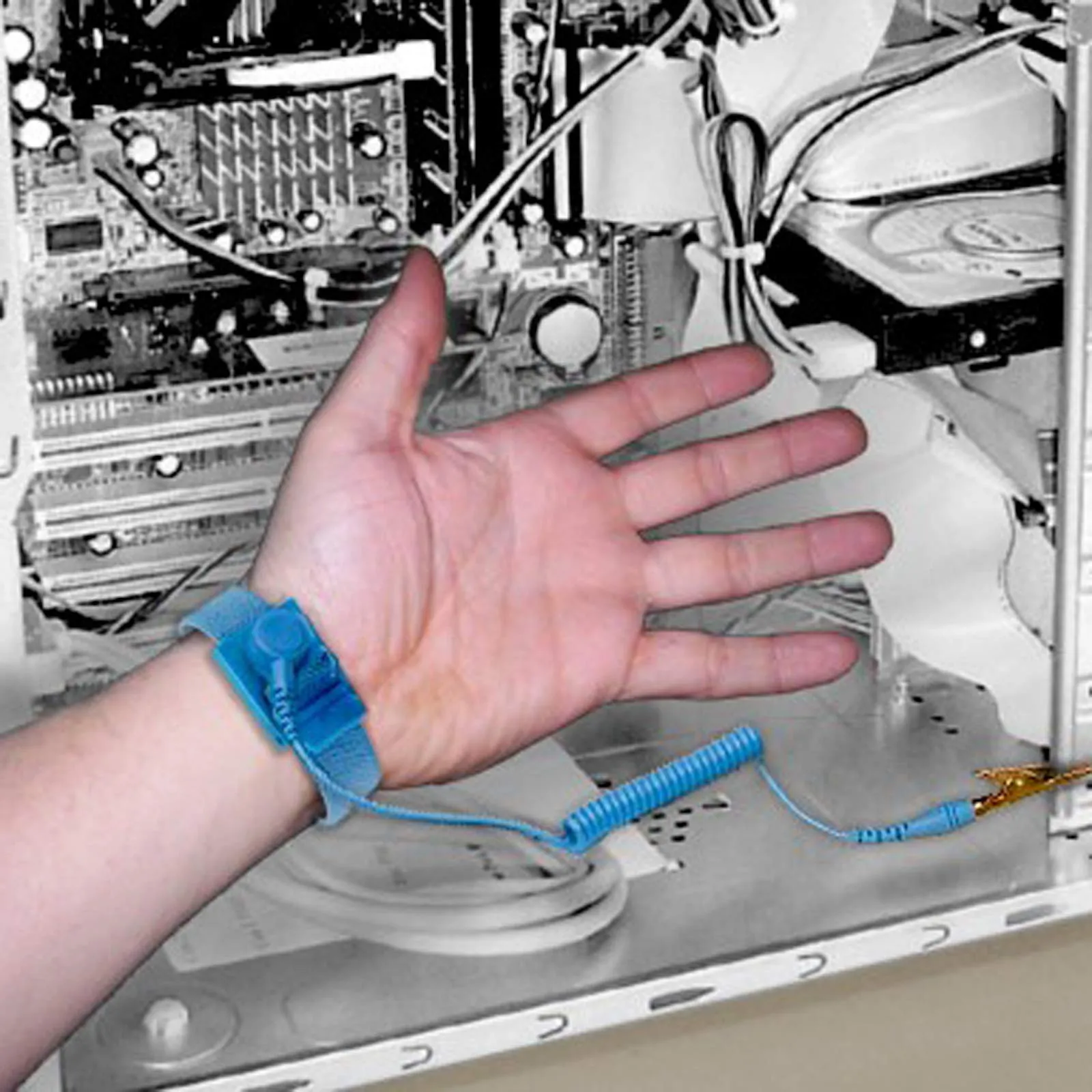 Technician using ESD wrist strap for PCB handling