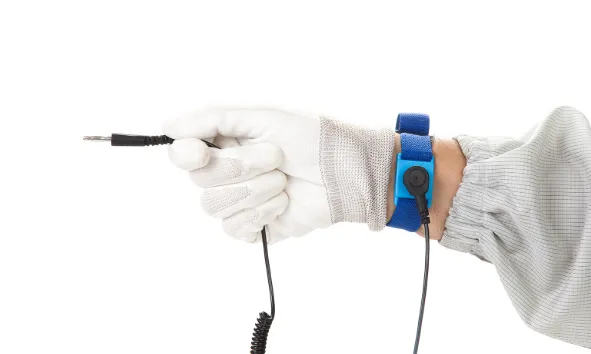 Place an image here showing a PCB being placed into an anti-static bag by a technician wearing an ESD wrist strap. ALT Text: "Technician using ESD-safe practices for PCB handling."