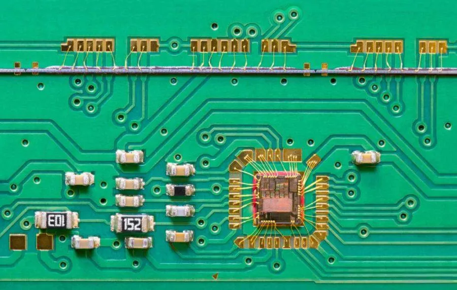 PCB design with EMI shielding and decoupling capacitors.