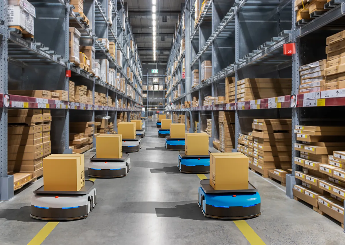Warehouse robot autonomously navigating through aisles.
