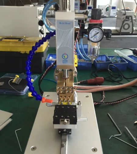 Workbench setup for through-hole soldering with tools like soldering iron, desoldering pump, and multimeter