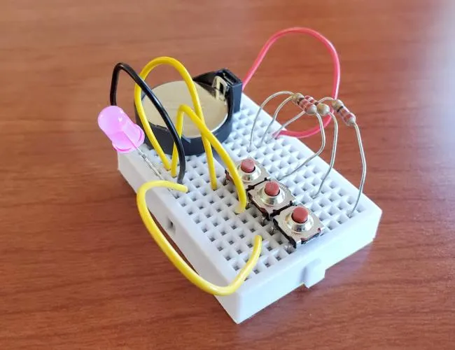 Breadboard circuit with terminal block distributing power for hobby electronics project.