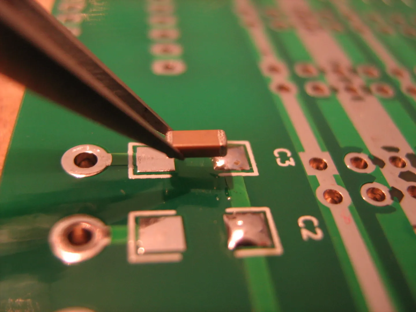 Close-up of a PCB with SMD components for DIY replacement