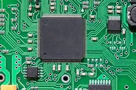 Microcontroller chip mounted on a PCB for embedded systems design."