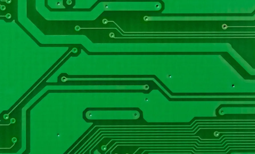 Close-up of PCB with laser-drilled micro-vias showcasing precision.