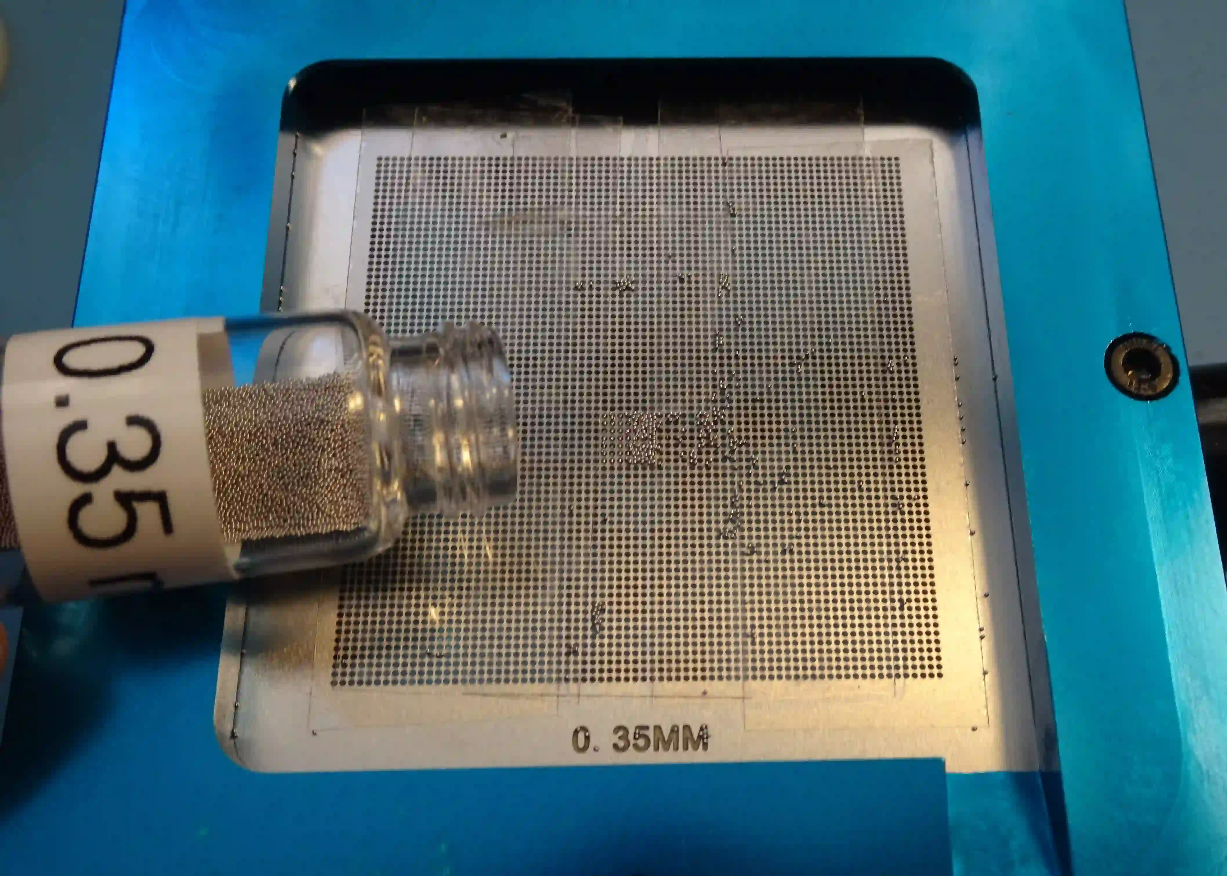 Reballing a BGA component using a stencil and solder balls.