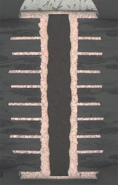 Cross-section of a PCB showing filled vias for electrical connectivity.