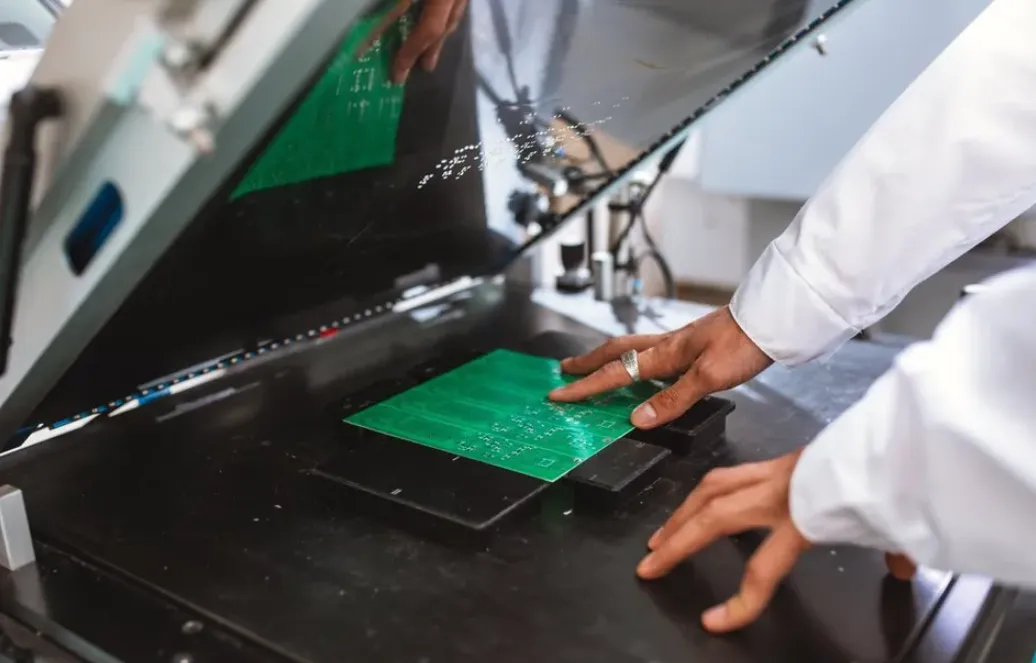 Screen printing setup for PCB legend application.