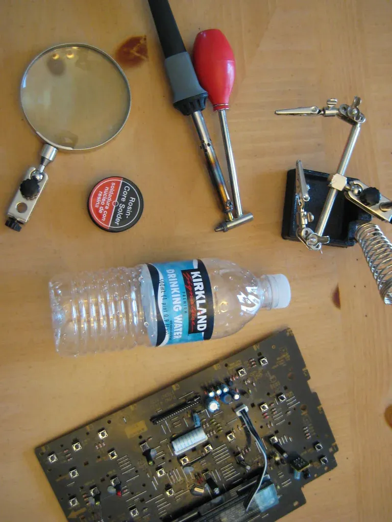 Workspace setup with tools for desoldering components from PCB