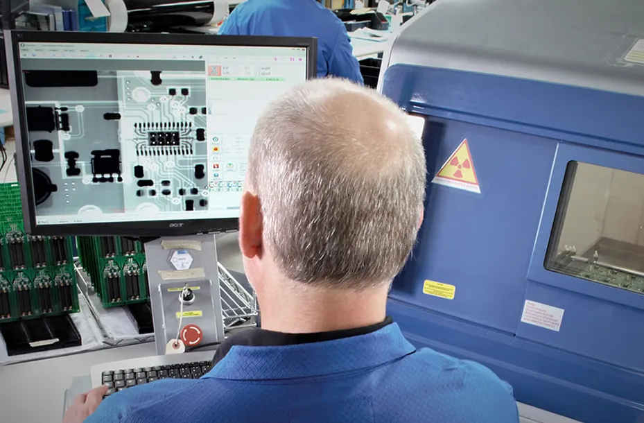 Technician calibrating PCB imaging equipment for quality assurance.