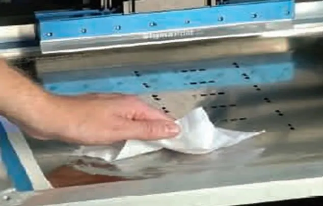 Technician cleaning SMT stencil to maintain assembly quality
