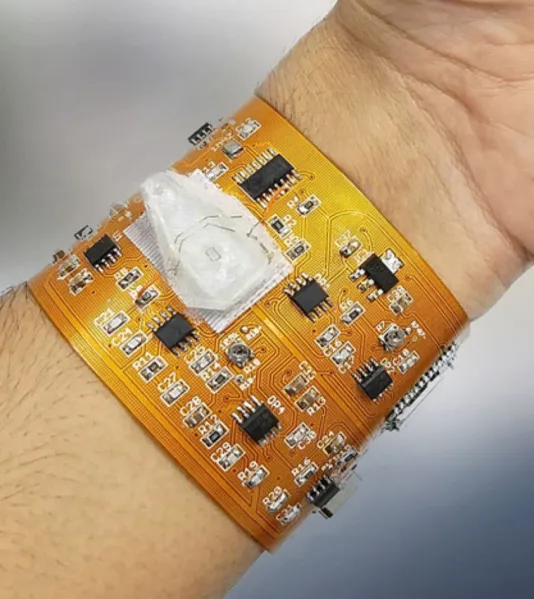 Flexible PCB inside a wearable health monitor for conformal fit