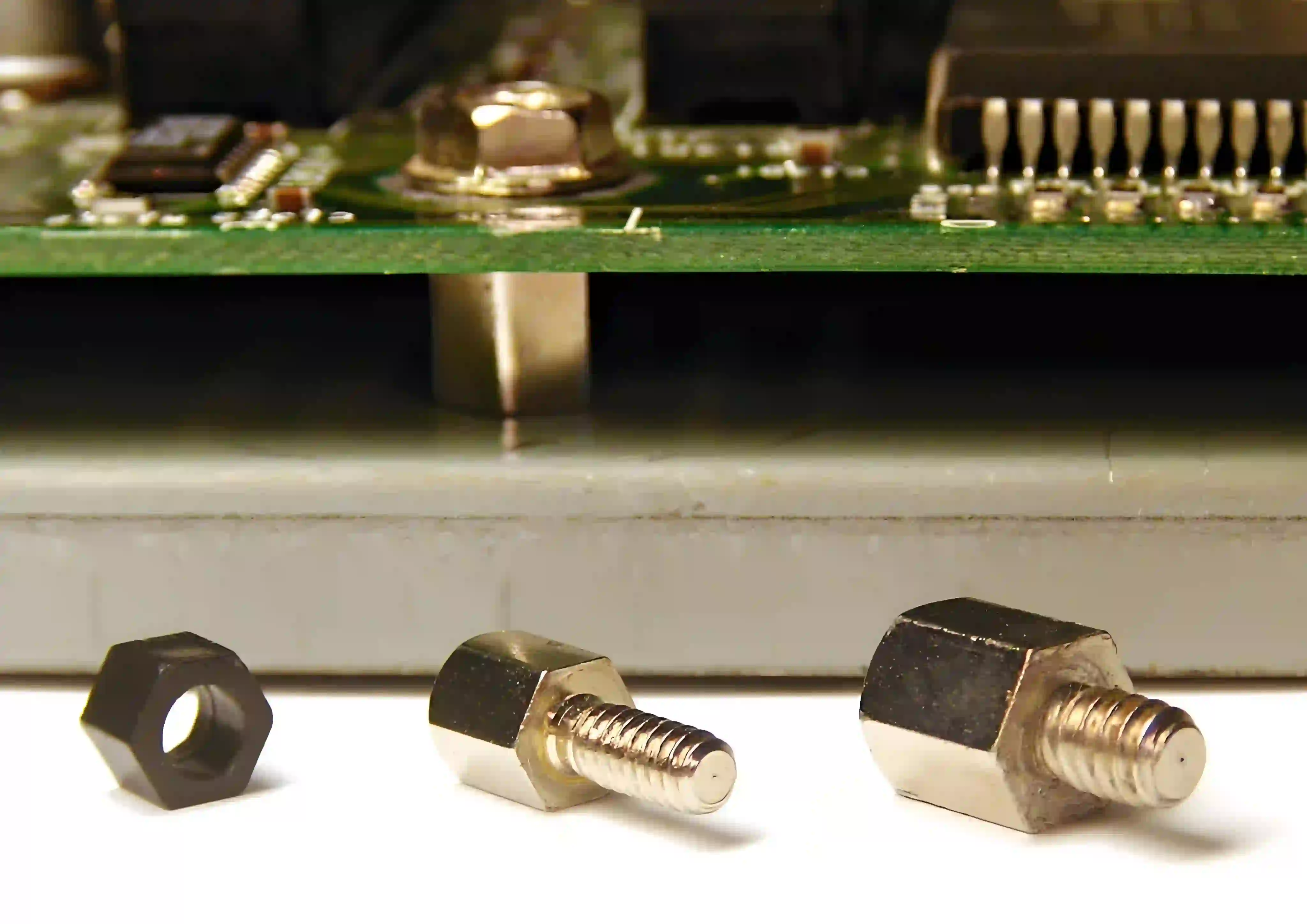 PCB mounted in enclosure using screws and standoffs for secure installation.