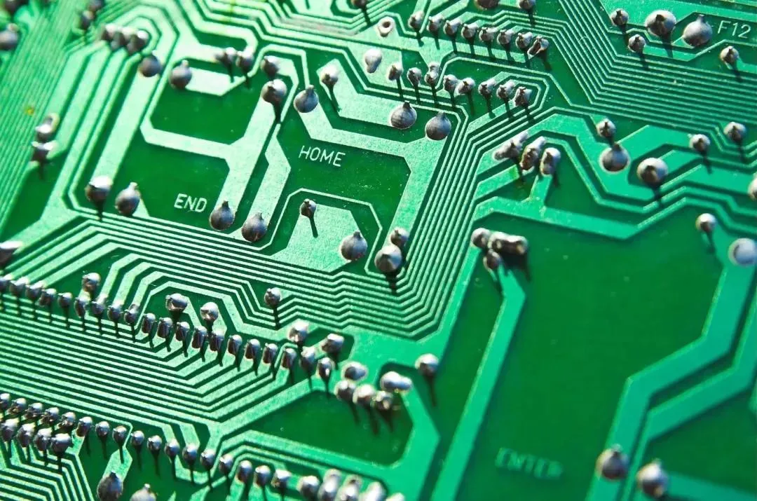 Through-hole components on a PCB with visible leads and soldering points.