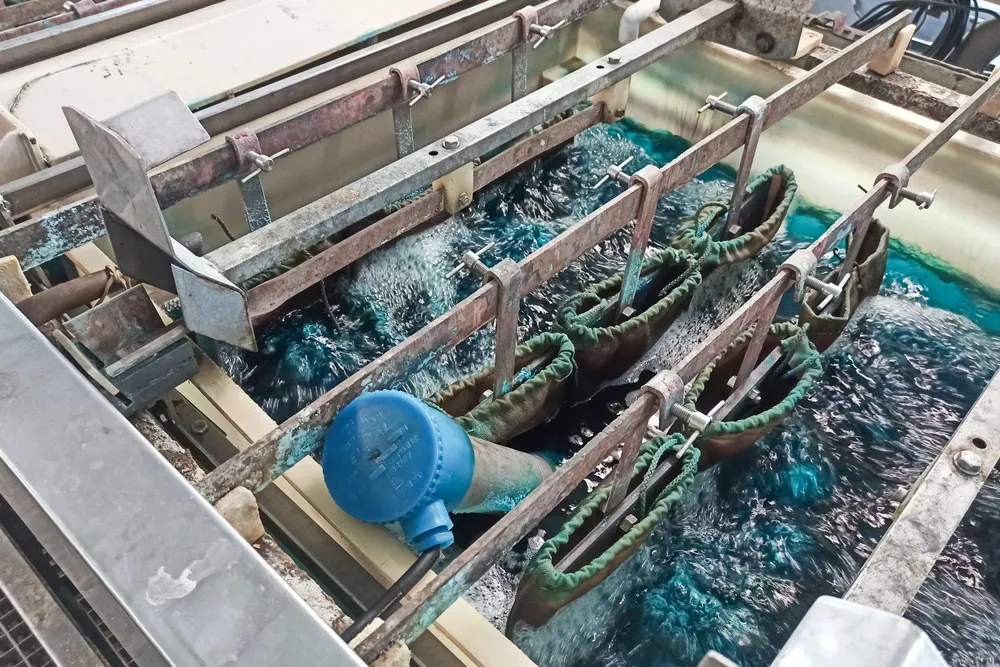 PCB undergoing electrolytic gold plating in a chemical bath
