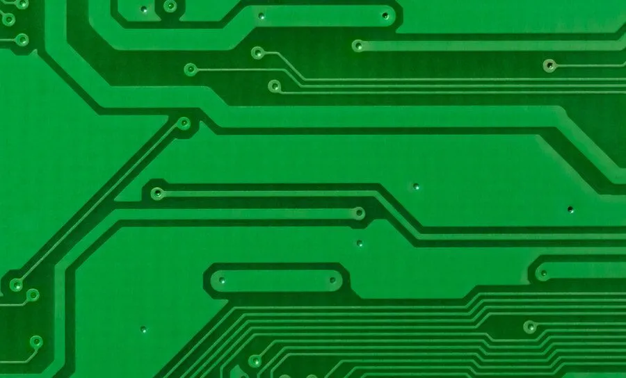Close-up of laser-drilled microvias on a high-density PCB for miniaturization