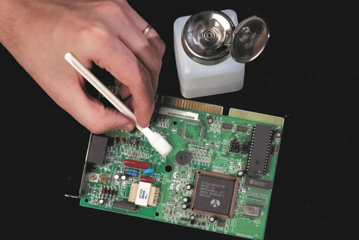 Manual PCB cleaning with isopropyl alcohol for clear board results.