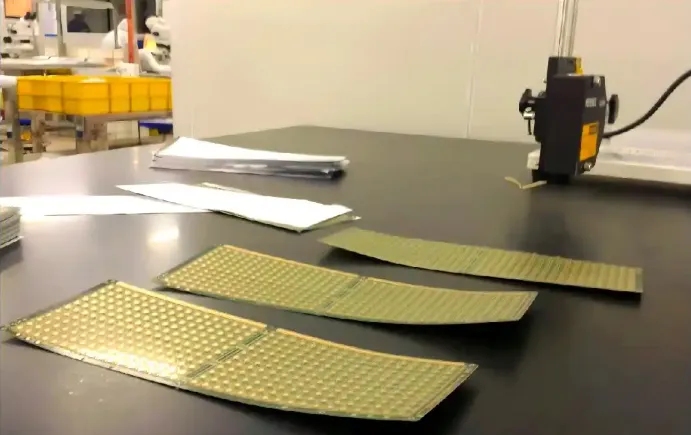 Measuring FR-4 PCB warpage with a dial gauge on a flat reference surface