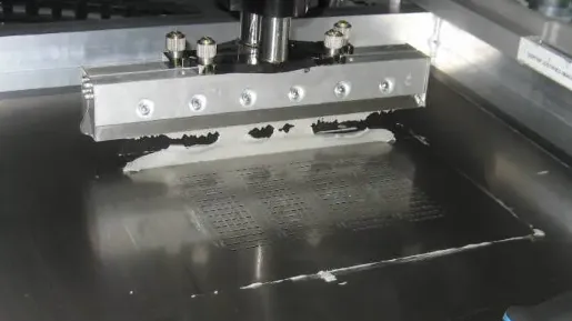 Applying solder paste to PCB using a stencil for SMT assembly