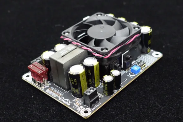 Dense PCB with advanced cooling solutions like fans and heat pipes.