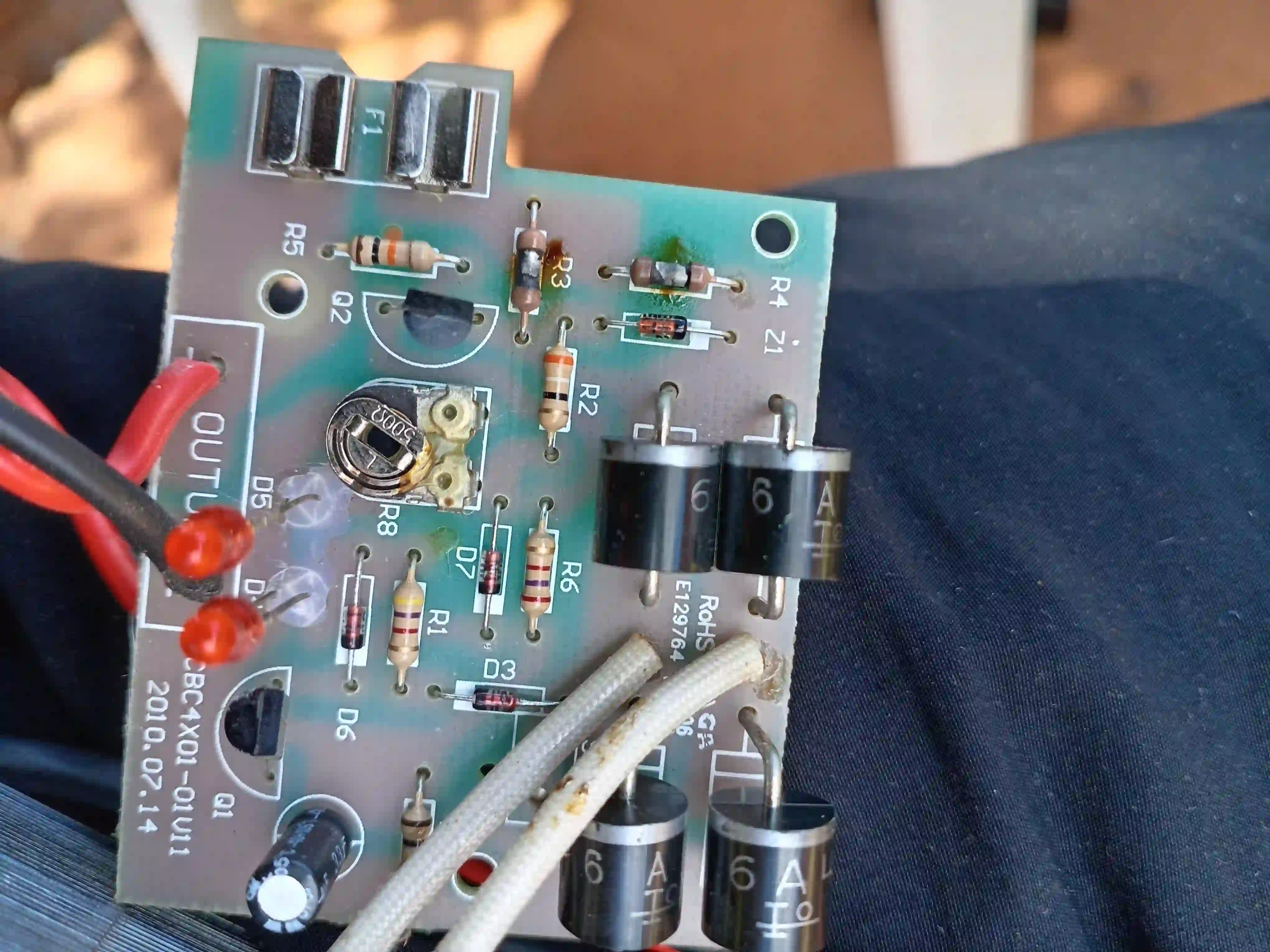 Close-up of resistors on a battery charger PCB