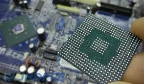 Close-up of a BGA component on a PCB showing solder ball array.