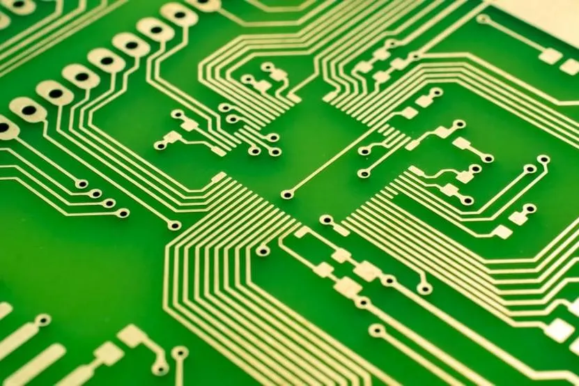 Close-up of PCB copper traces showing different widths for current handling.