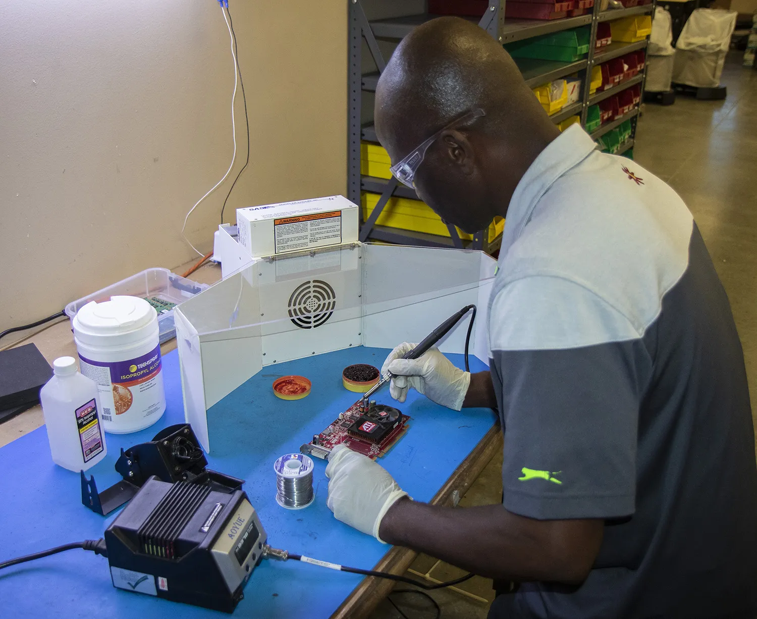 Soldering safety setup with protective gear and ventilation
