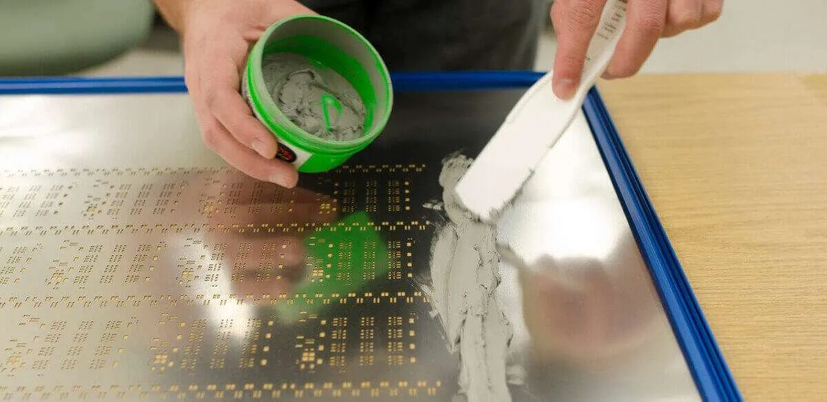 SMT stencil applying solder paste on a PCB for surface mount technology