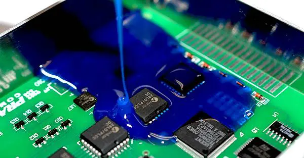 PCB with encapsulation resin protecting SMT components