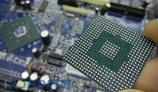 Close-up of BGA component on PCB showing solder ball array.