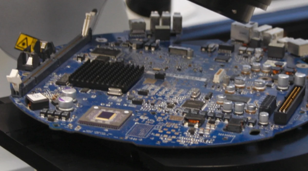 Microscopic view of cellulose-based PCB substrate with conductive traces